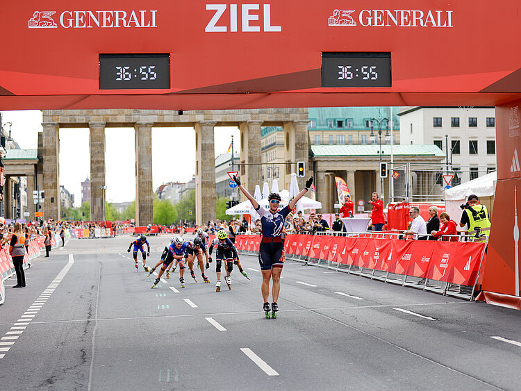 Laura Files winning the race on her skates.