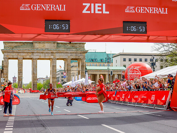 Tekle Muluat crosses the finish line as the first woman.